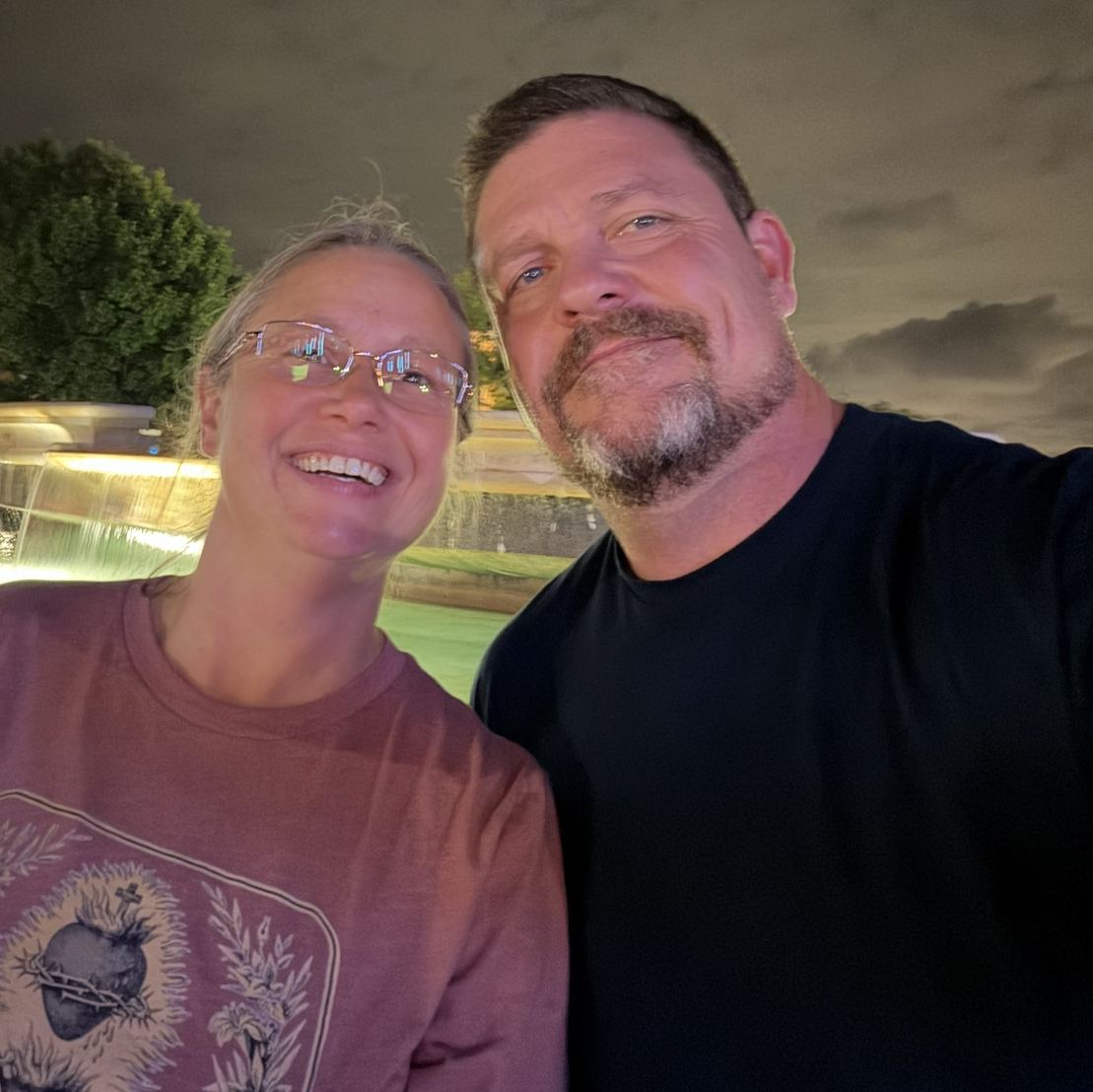 Steve and Sheri Baumgartner by a fountain at night